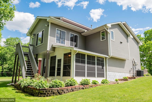 155 Palomino Ln, Lino Lakes, MN 55014 - back of house with stairway, a sunroom, a lawn, and cooling unit