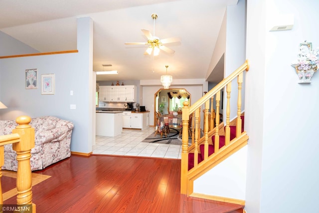 155 Palomino Ln, Lino Lakes, MN 55014 - living area with stairs, ceiling fan, light wood-style flooring, vaulted ceiling, and baseboards