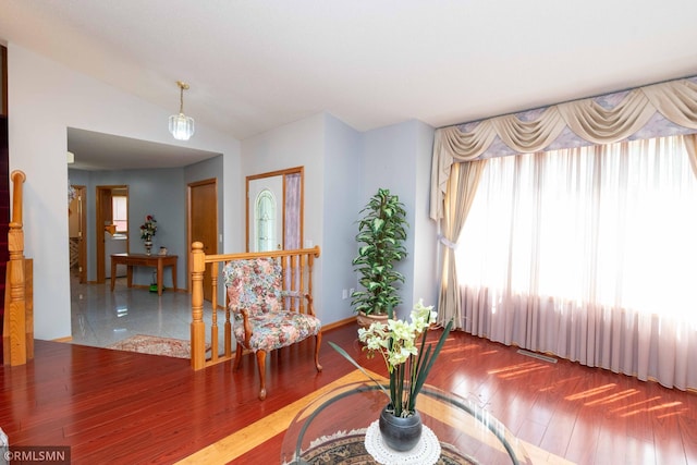 155 Palomino Ln, Lino Lakes, MN 55014 - living area featuring healthy amount of natural light, wood finished floors, and lofted ceiling