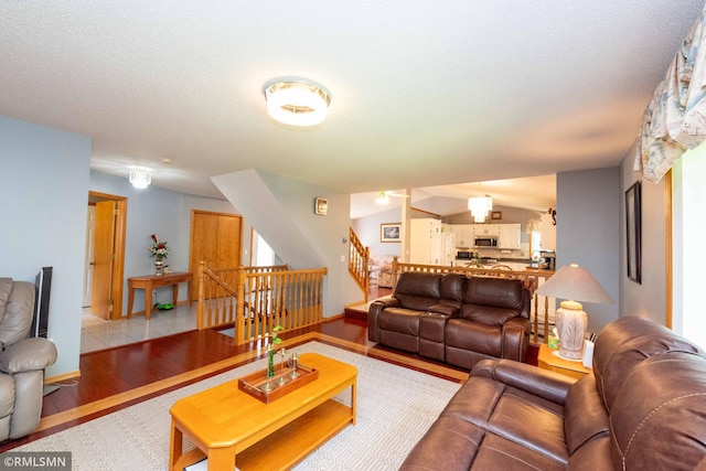 155 Palomino Ln, Lino Lakes, MN 55014 - living area with stairway, wood finished floors, ceiling fan, and baseboards