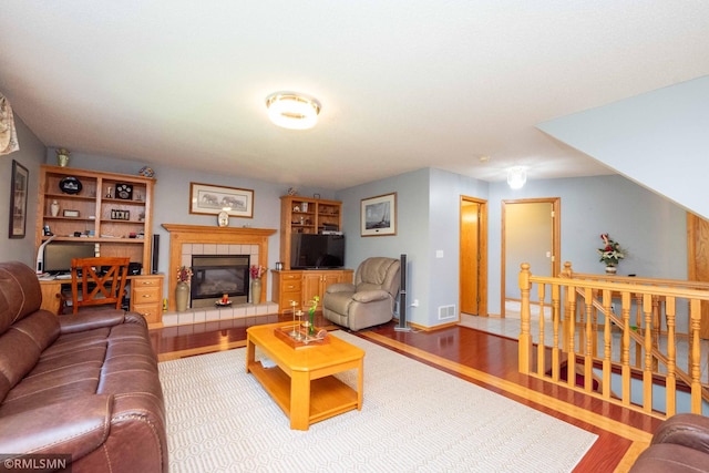 155 Palomino Ln, Lino Lakes, MN 55014 - living area featuring wood finished floors, a fireplace, and baseboards