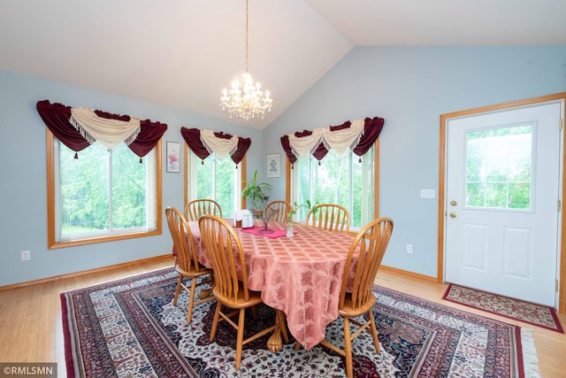 155 Palomino Ln, Lino Lakes, MN 55014 - dining space with a chandelier, wood finished floors, and lofted ceiling