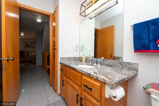 155 Palomino Ln, Lino Lakes, MN 55014 - bathroom featuring granite tiled floors, vanity, and baseboards
