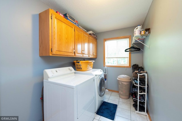 155 Palomino Ln, Lino Lakes, MN 55014 - laundry area with cabinet space, washer and dryer, and light tile patterned floors