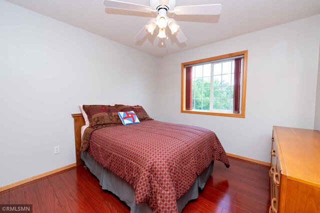 155 Palomino Ln, Lino Lakes, MN 55014 - bedroom featuring baseboards, wood finished floors, and a ceiling fan