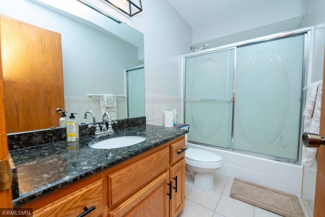 155 Palomino Ln, Lino Lakes, MN 55014 - bathroom featuring tile patterned flooring, vanity, toilet, and enclosed tub / shower combo