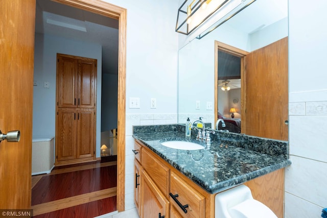 155 Palomino Ln, Lino Lakes, MN 55014 - bathroom featuring vanity, a wainscoted wall, and tile walls