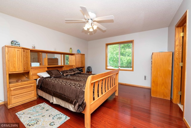 155 Palomino Ln, Lino Lakes, MN 55014 - bedroom featuring dark wood finished floors, baseboards, a textured ceiling, and a ceiling fan