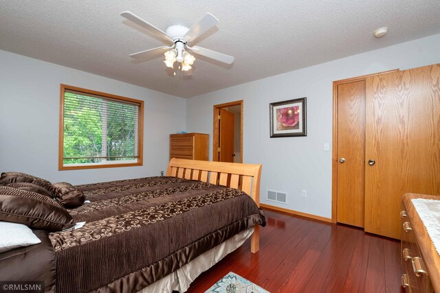 155 Palomino Ln, Lino Lakes, MN 55014 - bedroom with wood finished floors, a textured ceiling, baseboards, and ceiling fan
