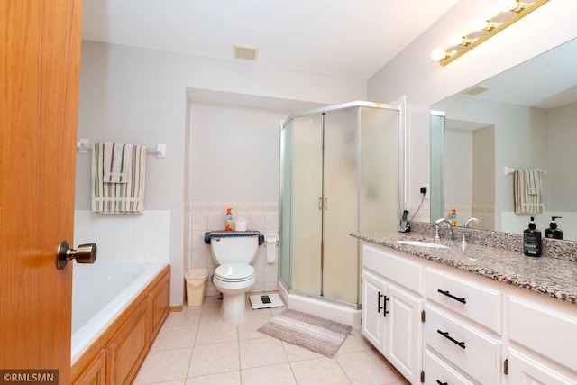 155 Palomino Ln, Lino Lakes, MN 55014 - full bath featuring vanity, tile patterned flooring, a shower stall, a bath, and toilet