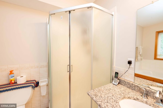 155 Palomino Ln, Lino Lakes, MN 55014 - full bath with tile walls, a shower stall, toilet, a garden tub, and vanity