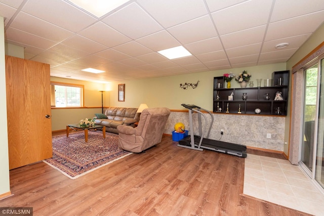 155 Palomino Ln, Lino Lakes, MN 55014 - living area featuring light wood-style floors, a paneled ceiling, healthy amount of natural light, and baseboards