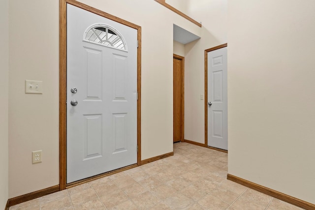 entryway featuring baseboards