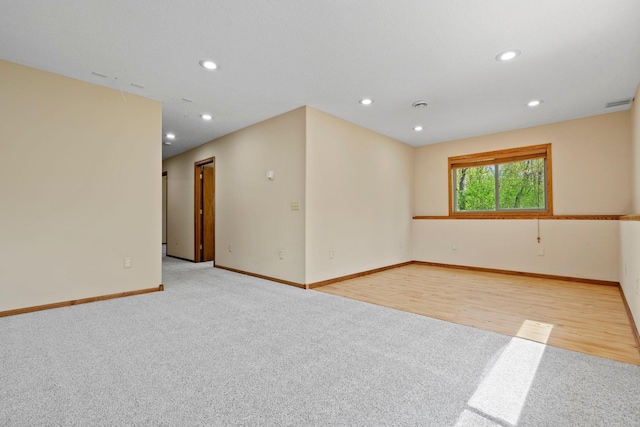 unfurnished room with carpet floors, baseboards, and recessed lighting