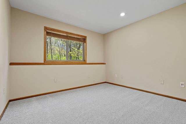 unfurnished room with carpet floors, baseboards, and recessed lighting