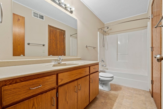 full bath featuring vanity, toilet, washtub / shower combination, ornamental molding, and a textured ceiling