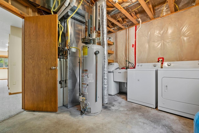 basement with gas water heater, separate washer and dryer, and a water softener