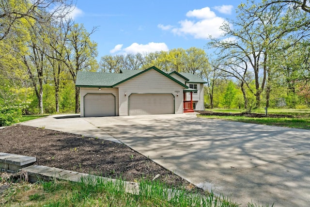 view of front of house featuring an attached garage and concrete driveway