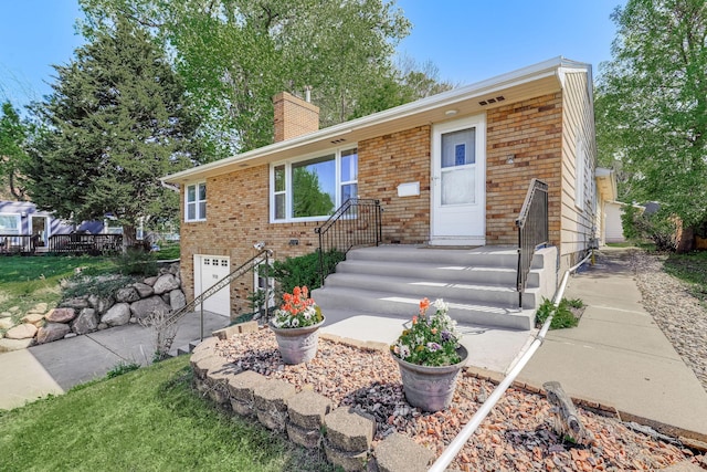 998 Saint Paul Ave, Saint Paul, MN 55116 - ranch-style home featuring brick siding, an attached garage, and a chimney