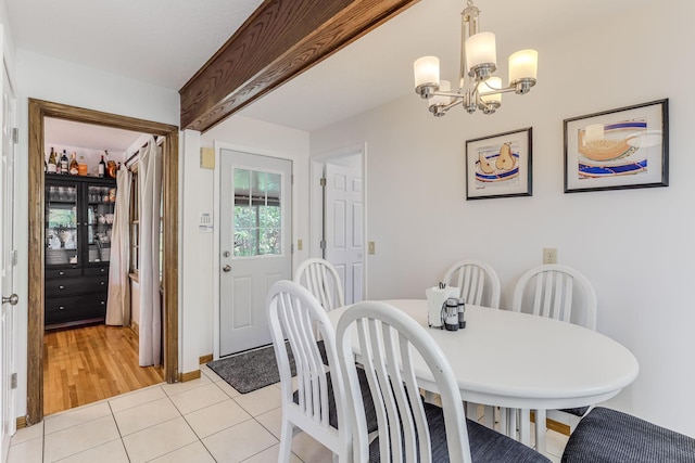 998 Saint Paul Ave, Saint Paul, MN 55116 - dining area with light tile patterned floors and a chandelier