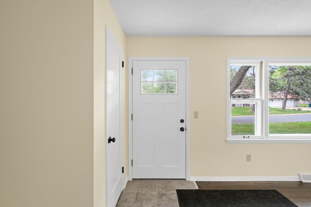 2756 Sunset Ln, Burnsville, MN 55337 - foyer entrance featuring baseboards and plenty of natural light