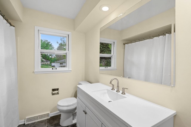 2756 Sunset Ln, Burnsville, MN 55337 - full bath with toilet, vanity, and baseboards