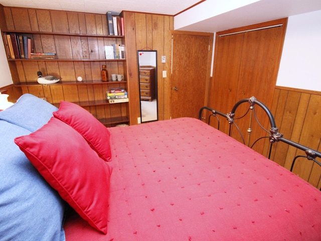 bedroom with wooden walls
