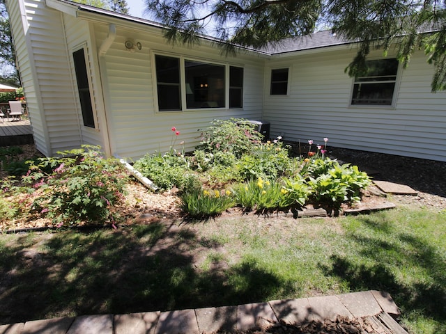 view of home's exterior featuring a wooden deck