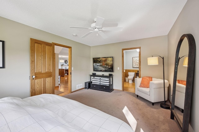 10547 Hollister Ave NW, Maple Lake, MN 55358 - carpeted bedroom featuring a ceiling fan, ensuite bathroom, and baseboards