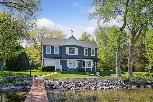 10547 Hollister Ave NW, Maple Lake, MN 55358 - view of front of home featuring a front lawn and a water view