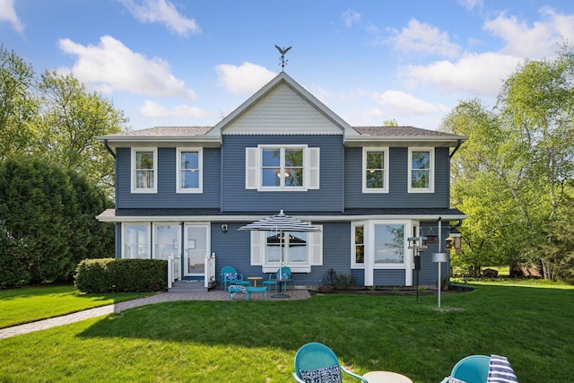 10547 Hollister Ave NW, Maple Lake, MN 55358 - back of house with a yard, entry steps, a patio, and a shingled roof