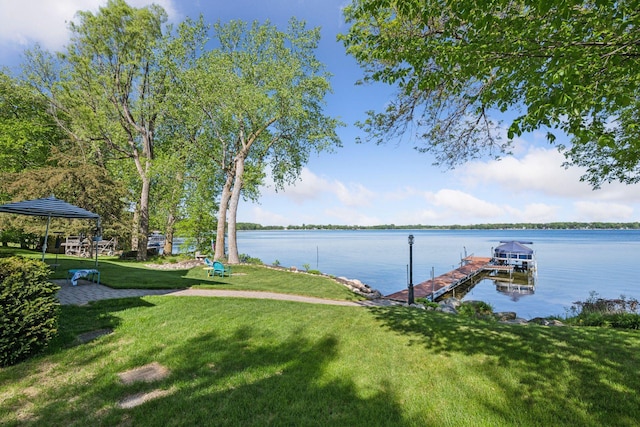 10547 Hollister Ave NW, Maple Lake, MN 55358 - dock area featuring a yard and a water view