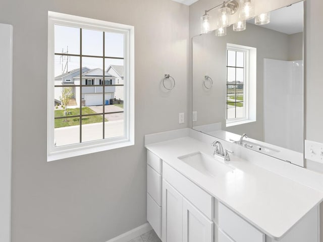 bathroom featuring baseboards and vanity