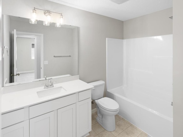 bathroom with toilet, vanity, tile patterned floors, and tub / shower combination