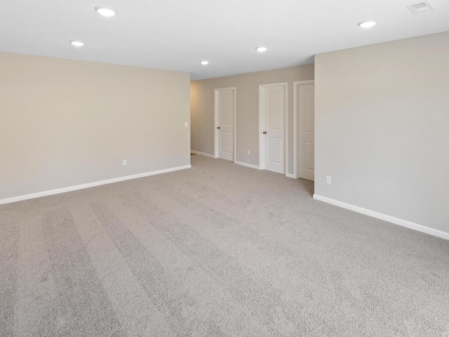 unfurnished room with baseboards, recessed lighting, and carpet flooring