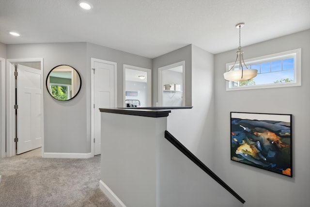 9587 Jada Way, Elko New Market, MN 55020 - hall with an upstairs landing, carpet, baseboards, and recessed lighting