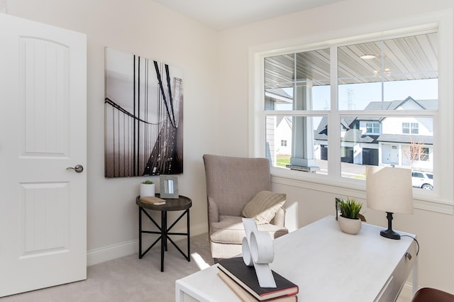 sitting room with light carpet and baseboards