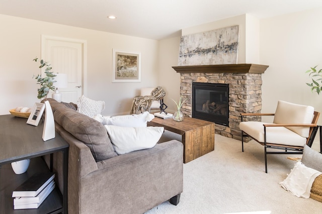 living room featuring carpet, a fireplace, and recessed lighting