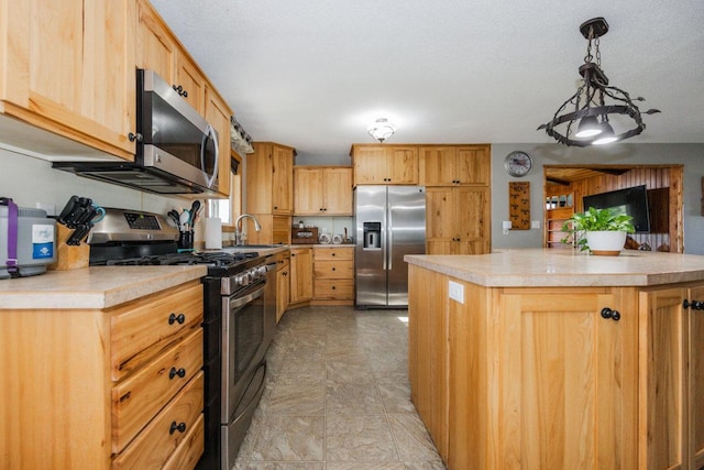 35445 County Highway 36, Vergas, MN 56587 - kitchen featuring stainless steel appliances, a sink, light countertops, a kitchen island, and hanging light fixtures