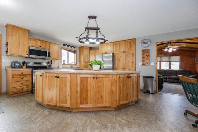 35445 County Highway 36, Vergas, MN 56587 - kitchen with appliances with stainless steel finishes, plenty of natural light, light countertops, and a ceiling fan