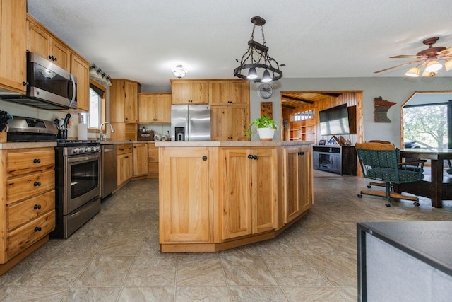 35445 County Highway 36, Vergas, MN 56587 - kitchen with appliances with stainless steel finishes, healthy amount of natural light, a center island, and a ceiling fan