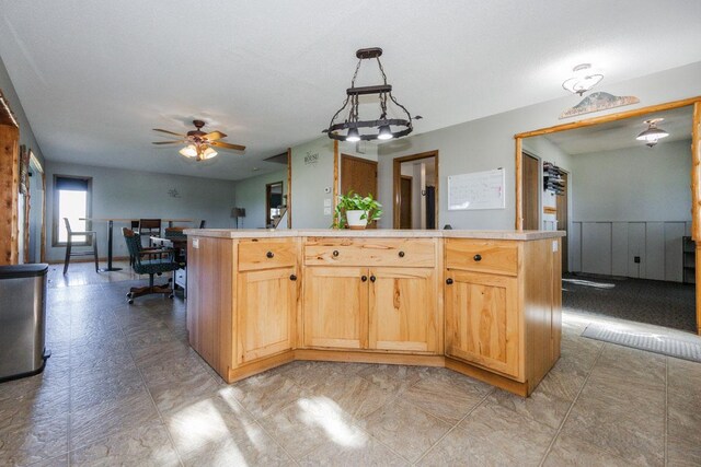 35445 County Highway 36, Vergas, MN 56587 - kitchen with an office area, ceiling fan, tile countertops, and a center island