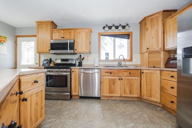 35445 County Highway 36, Vergas, MN 56587 - kitchen with appliances with stainless steel finishes, a sink, plenty of natural light, and light countertops