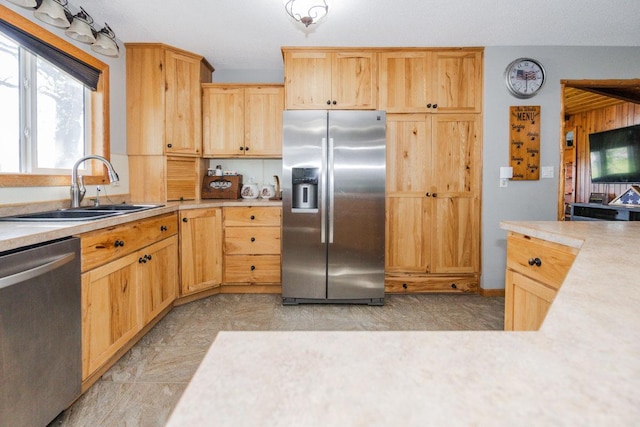 35445 County Highway 36, Vergas, MN 56587 - kitchen with stainless steel appliances, a sink, light countertops, and light brown cabinetry