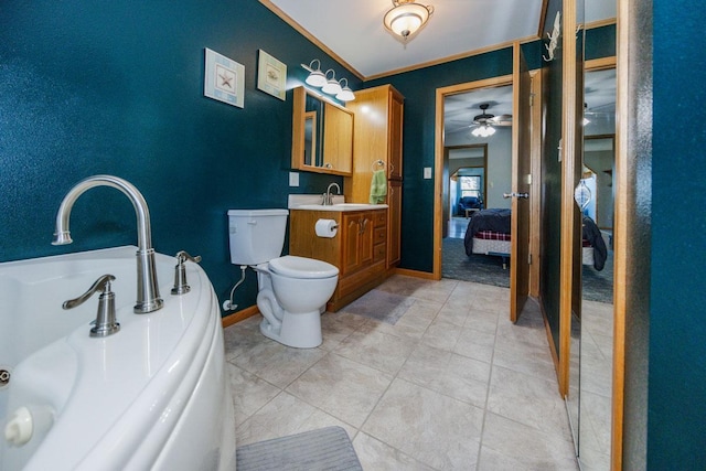 35445 County Highway 36, Vergas, MN 56587 - bathroom featuring connected bathroom, toilet, ceiling fan, baseboards, and vanity