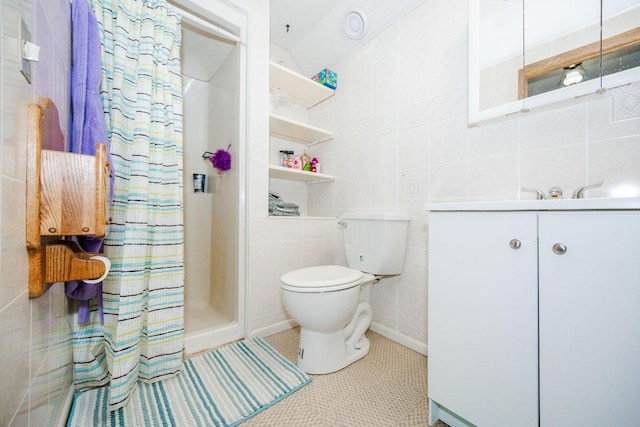 35445 County Highway 36, Vergas, MN 56587 - bathroom featuring a stall shower, tile walls, vanity, toilet, and tile patterned floors