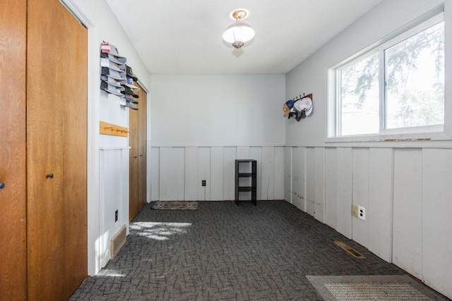 35445 County Highway 36, Vergas, MN 56587 - carpeted empty room featuring a wainscoted wall and a decorative wall