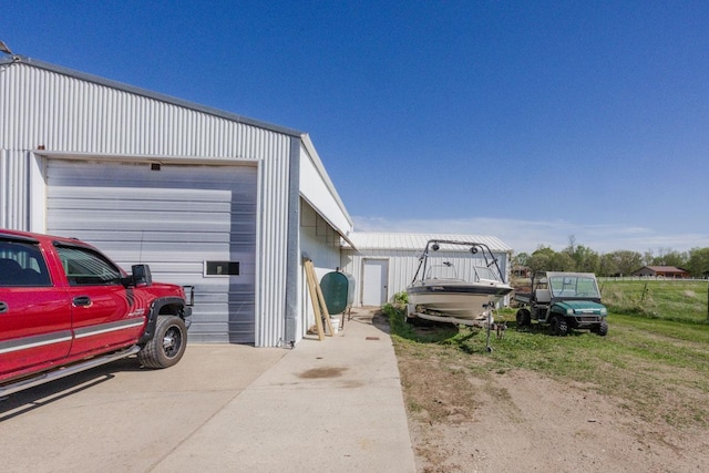 35445 County Highway 36, Vergas, MN 56587 - view of side of home featuring driveway, an outbuilding, and a garage