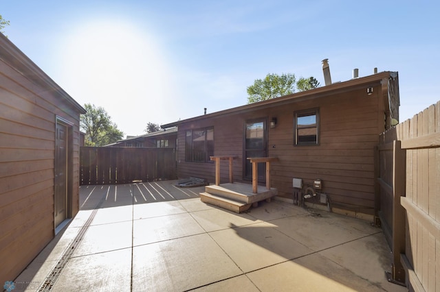 back of house with a patio area and fence
