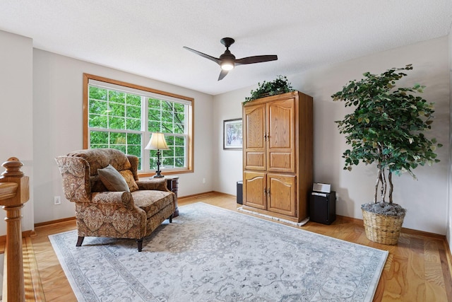 2715 Autumn Woods Dr, Chaska, MN 55318 - living area featuring a ceiling fan, baseboards, and light wood finished floors